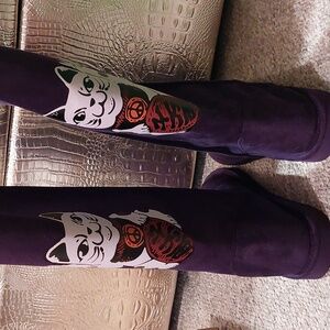 Purple boots with lucky cats on the back